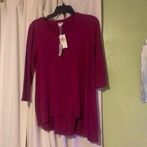 Dressy burgundy shirt with quarter sleeves.